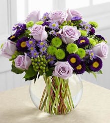 Lavender roses, monte casino asters and hypericum