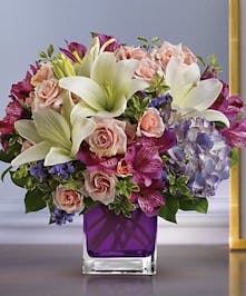 Cube vase filled with Hydrangea, Roses and Lilies 