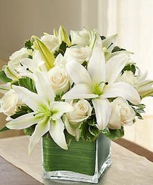 White Roses and White Lilies in a Ti Leaf Lined Cube Vase 
