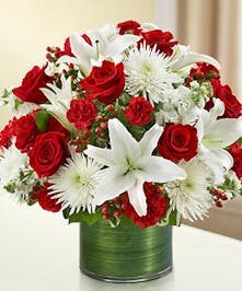 Red & White Mixed Flowers in a Ti Leaf Wrapped Cylinder Vase 